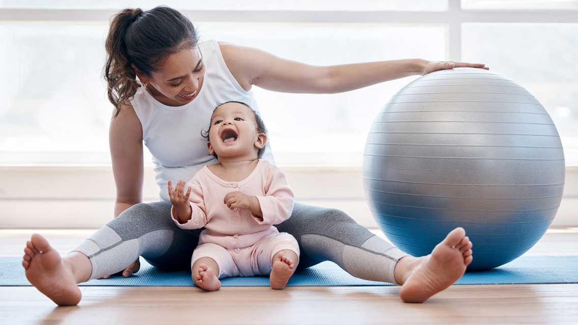 a new mom exercises with her baby