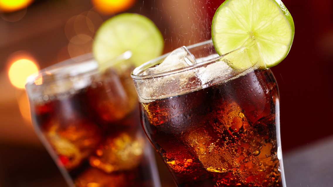 two glasses of diet soda with a wedge of lime