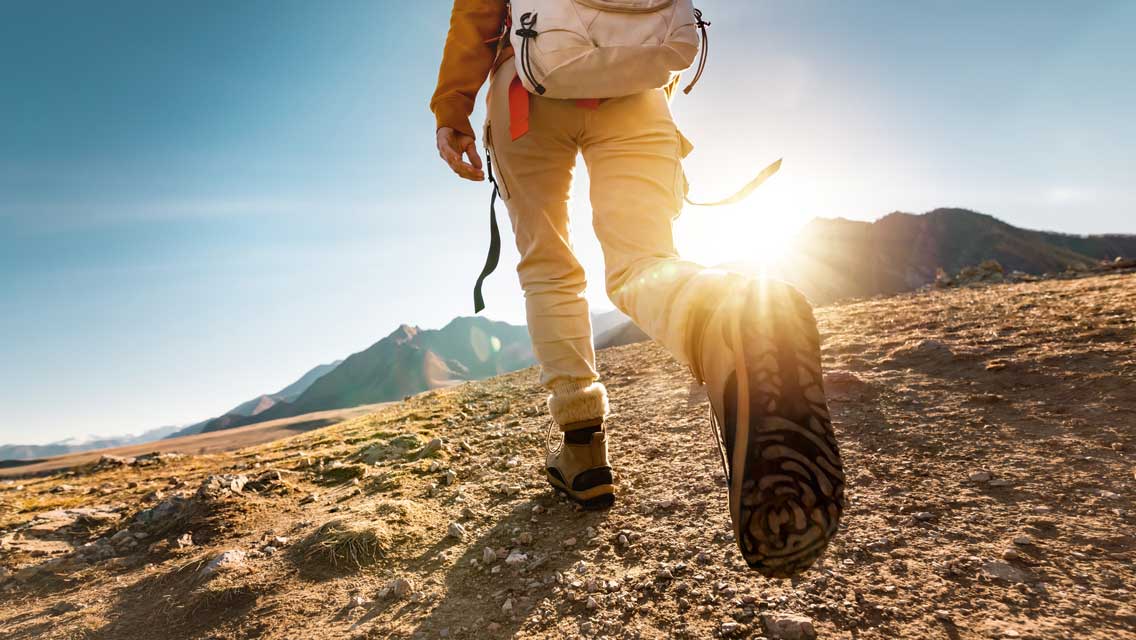 a person hiking over rough terrain