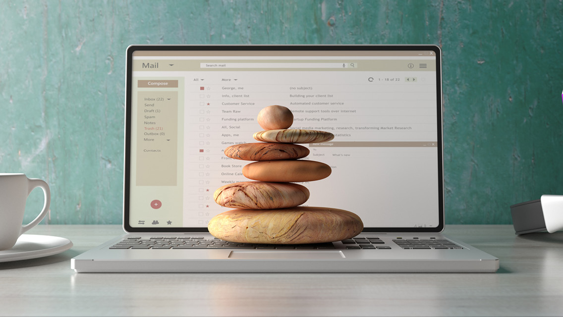a stack of balancing rocks on a computer
