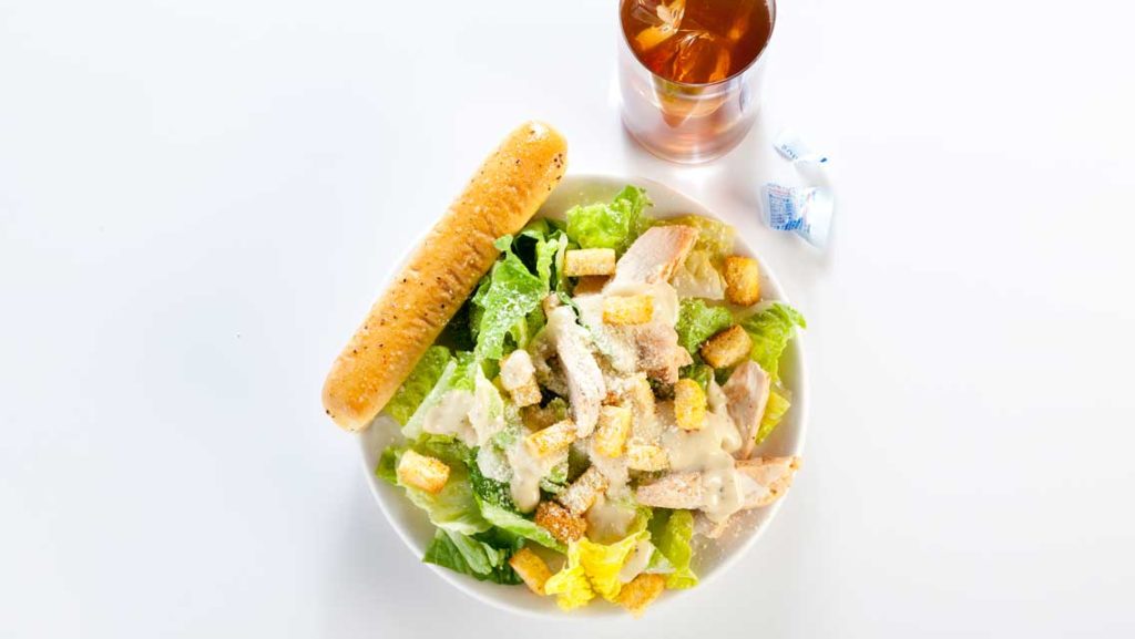 bad lunch of Caesar salad and sweetened ice tea