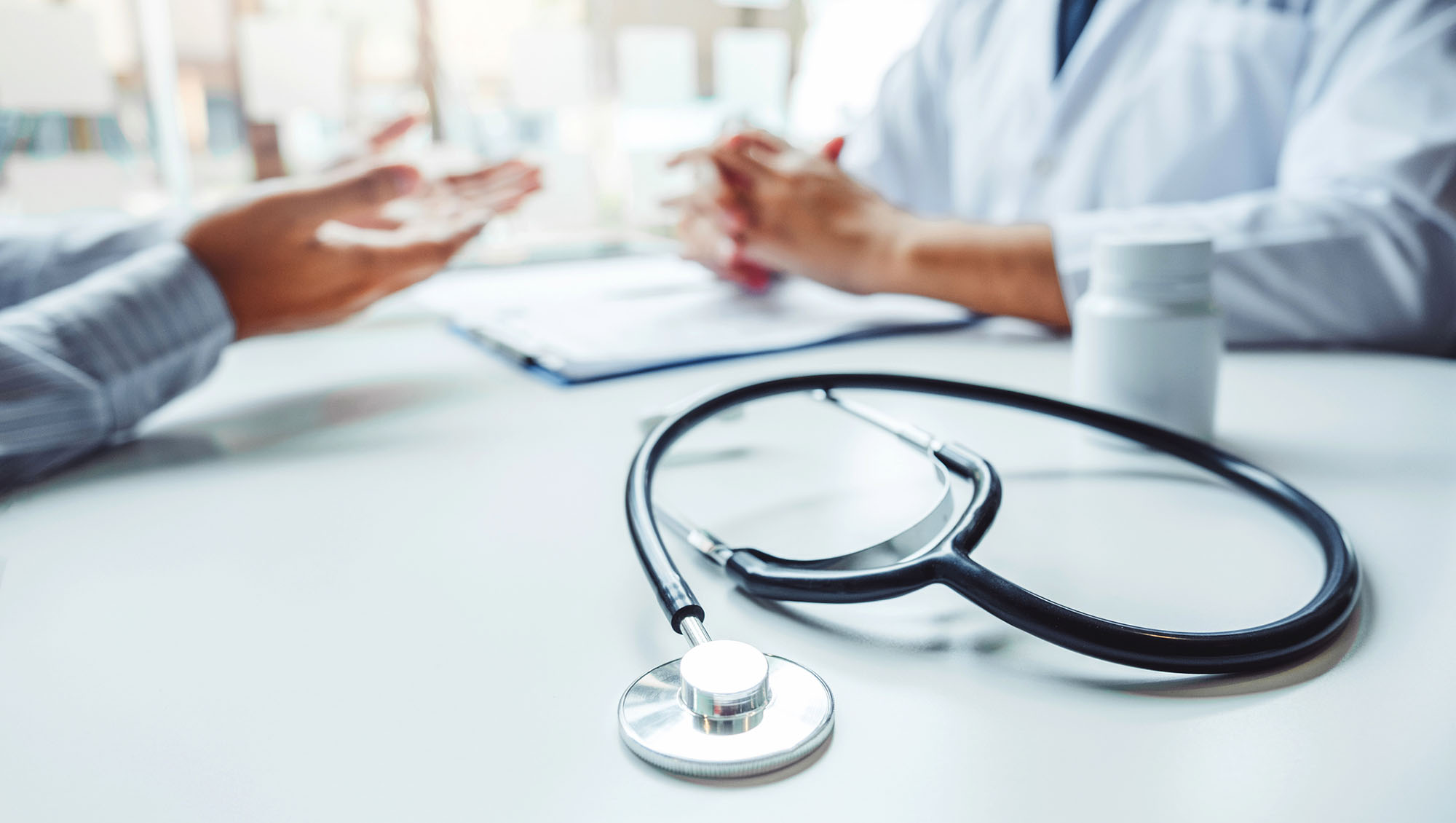 Doctors and patients consulting and diagnostic examining sit and talk