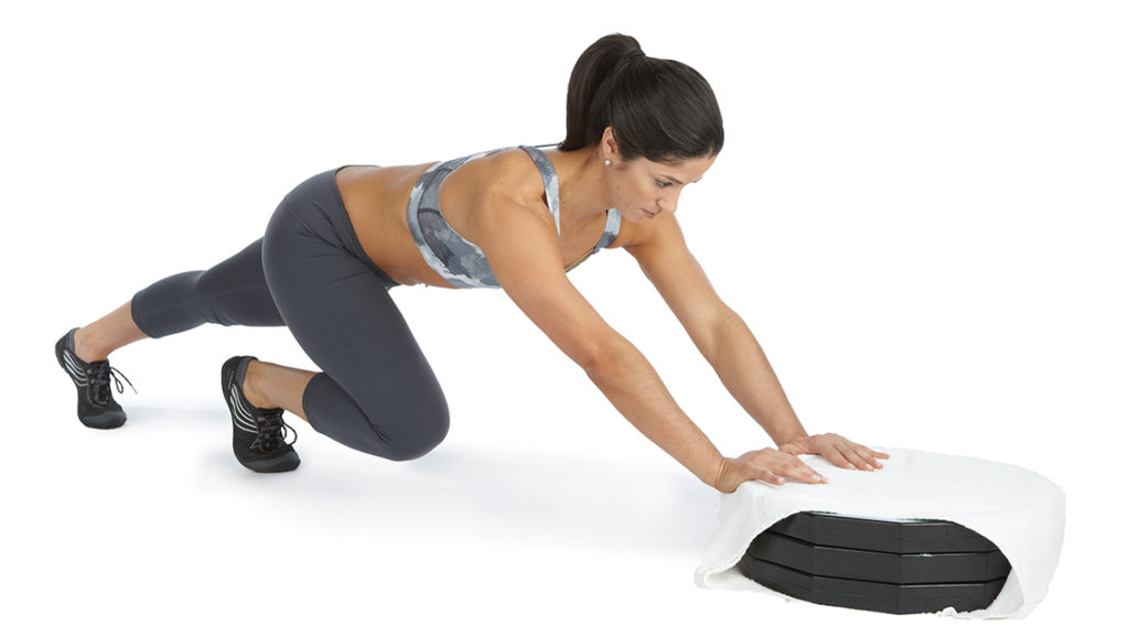 a woman performs a plate push
