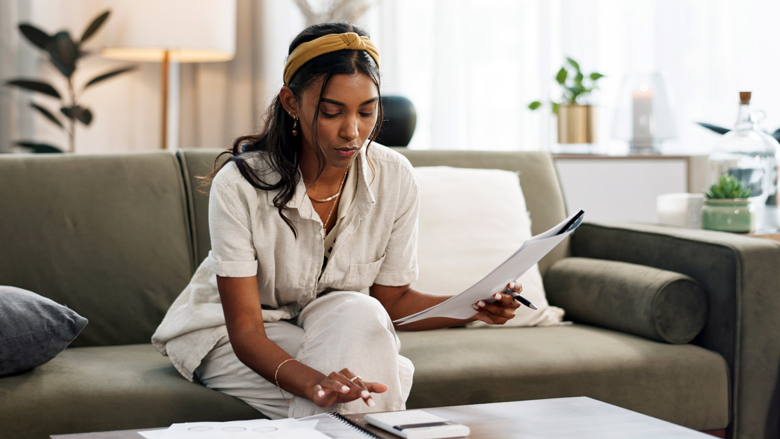 a young woman works on her finances
