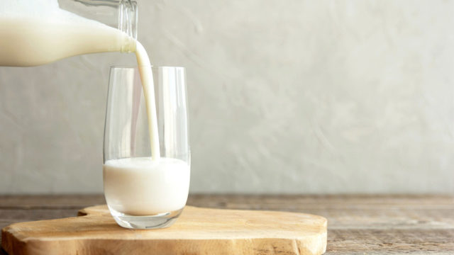 milk being poured into a glass