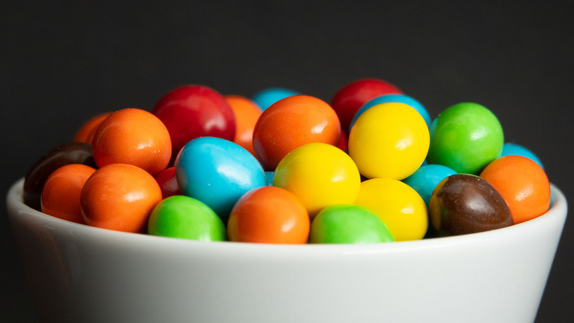 Close up of a pile of colorful chocolate coated candy