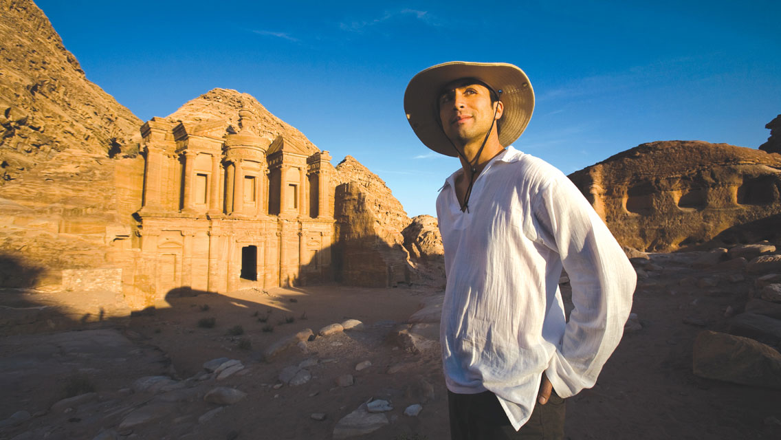 a man stands by Petra