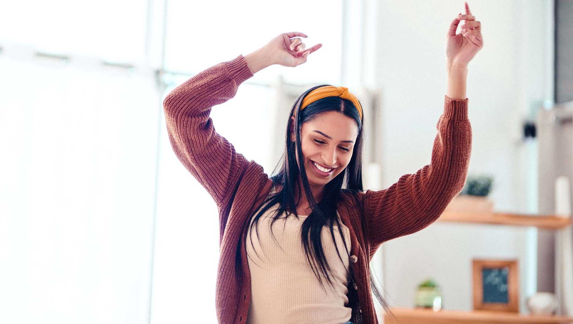 a woman dances at home