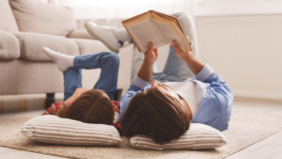 a mom reads with her child