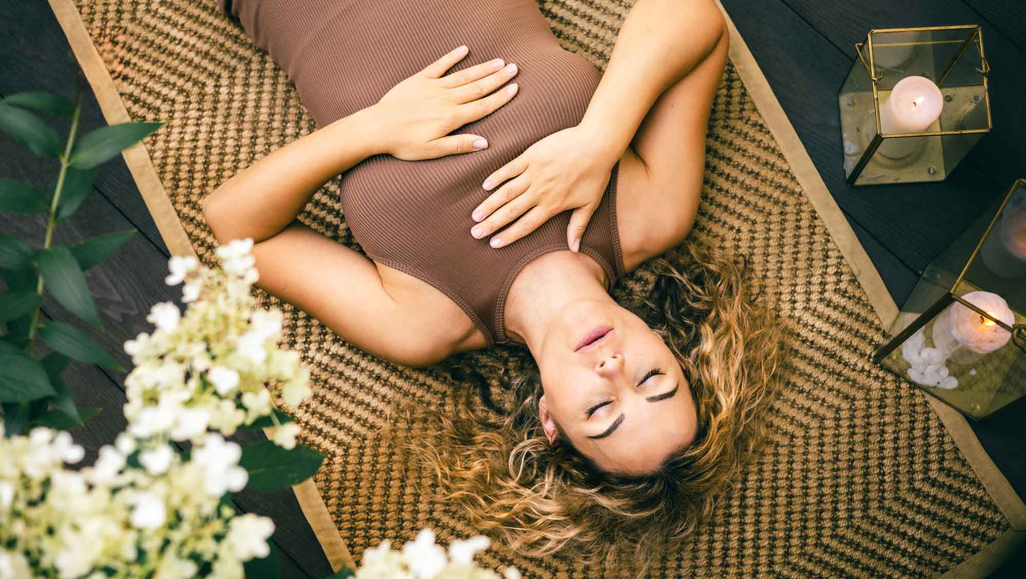 a woman rests in savasana