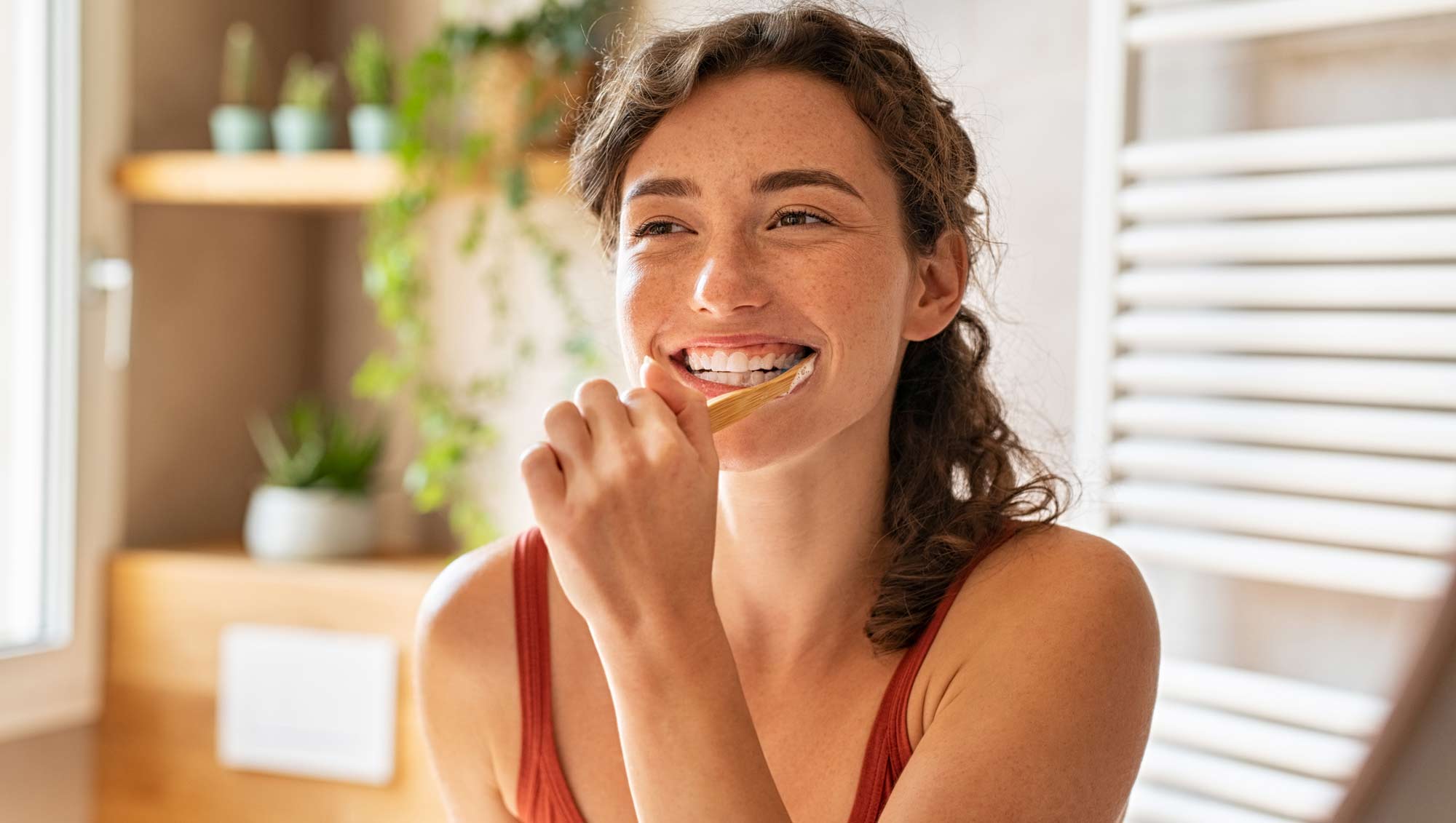 woman brushing her teeth