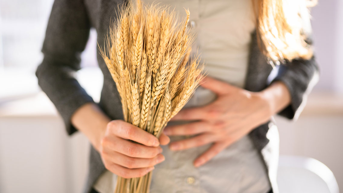 Women holding spikelet of wheat