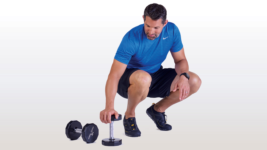 a man rests between workout sets