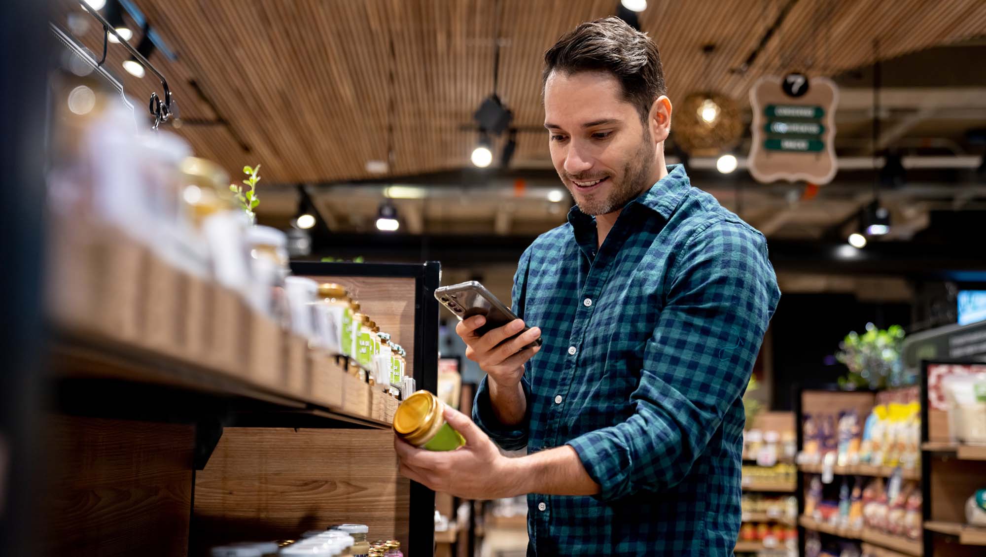 a man scan's a jars food label for more information