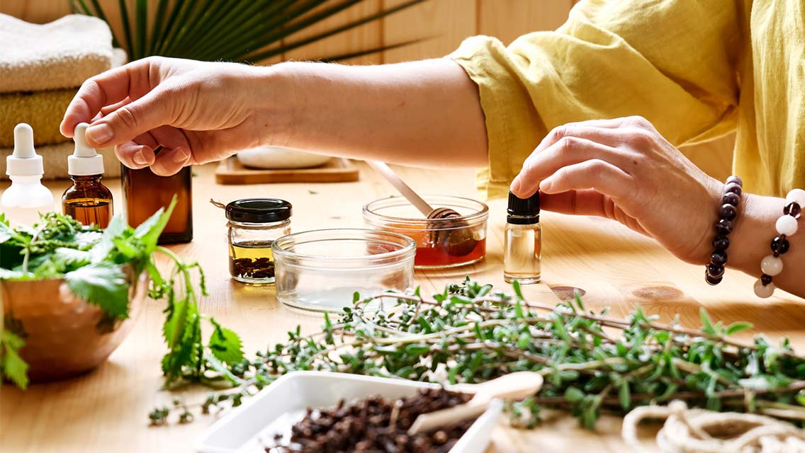 Woman prepares different types of oils and essences