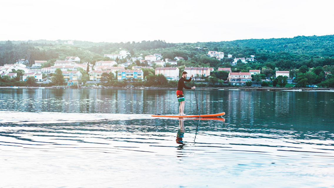 Person Stand-up Paddleboarding