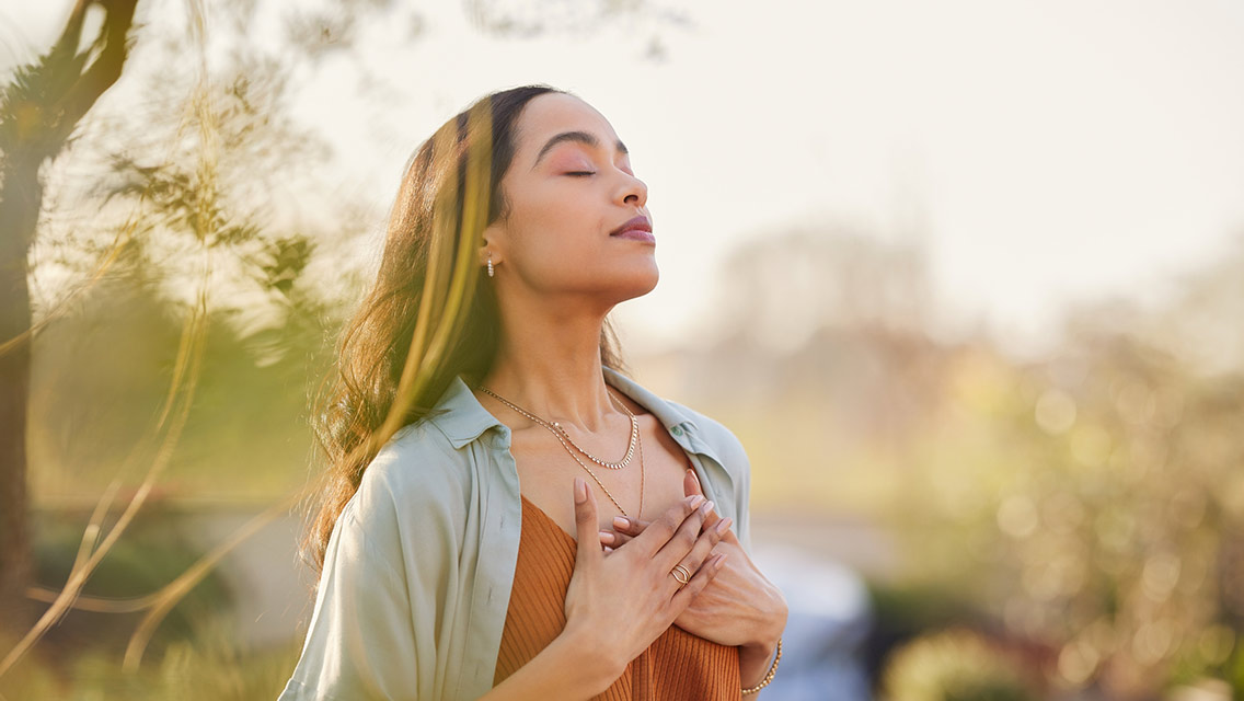 Woman enjoying nature while meditating