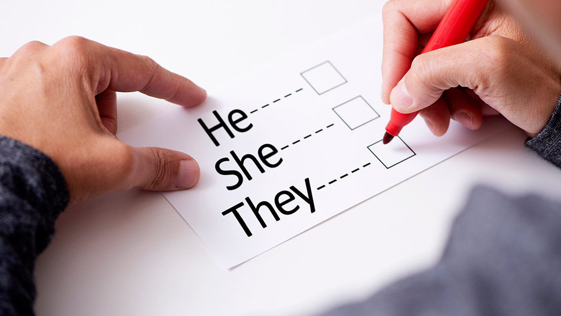 A person chooses between three pronouns: he, she, and they.