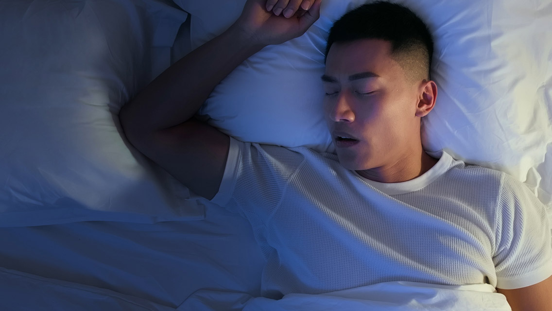 a man sleeps with his mouth slightly open