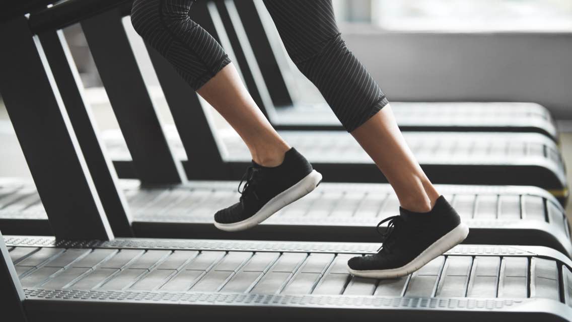 Feet running on a treadmill