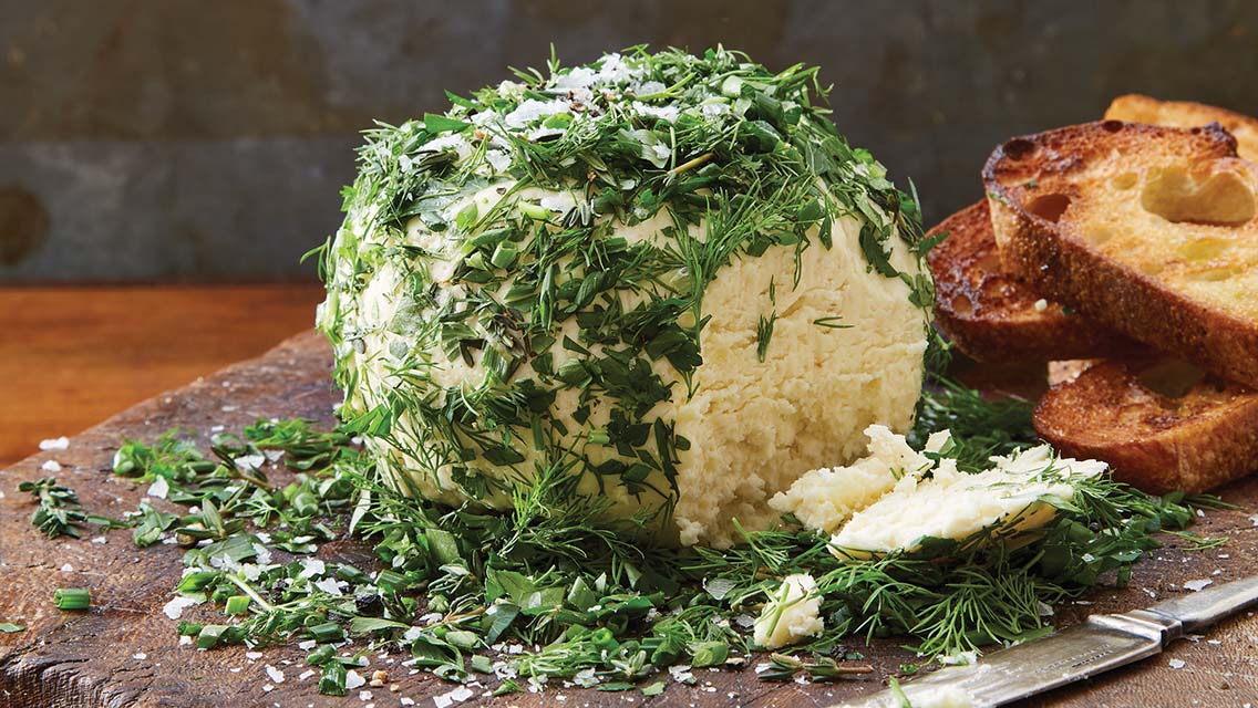 cheese ball coated with herb herbs