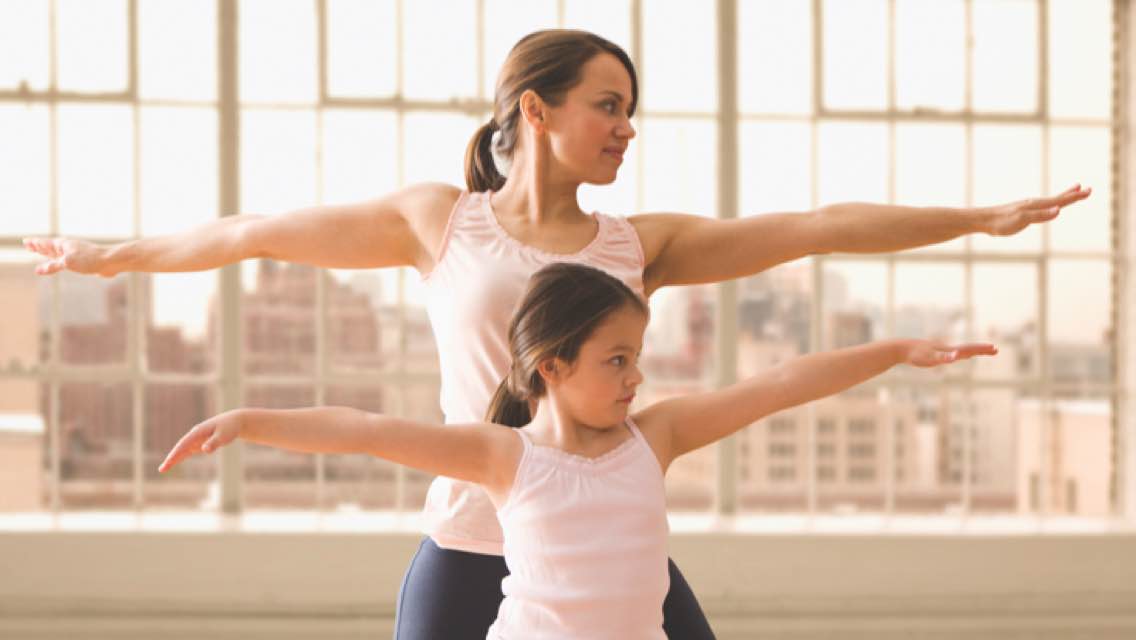 Mom and daughter exercising together.