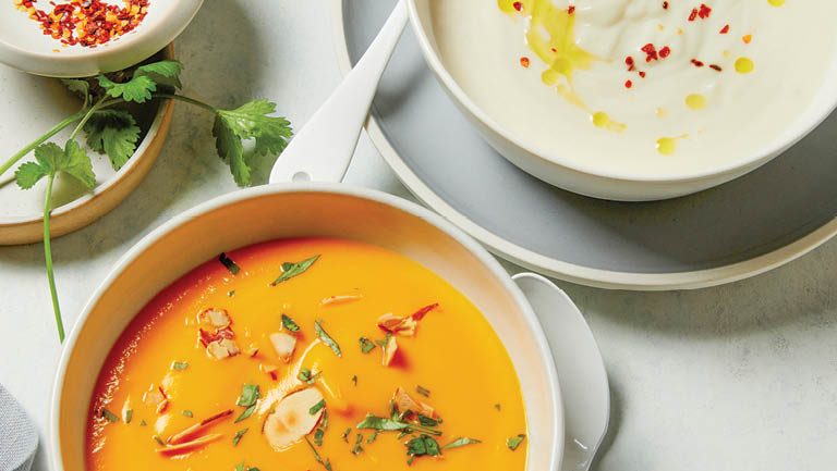 A bowl of creamy orange soup