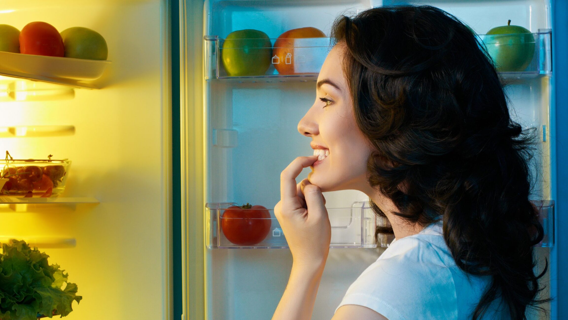 Woman looking in the refrigerator