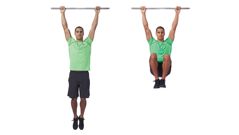 A man performs a hanging knee raise.