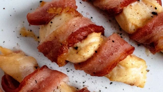 Three bacon-wrapped chicken tenders.