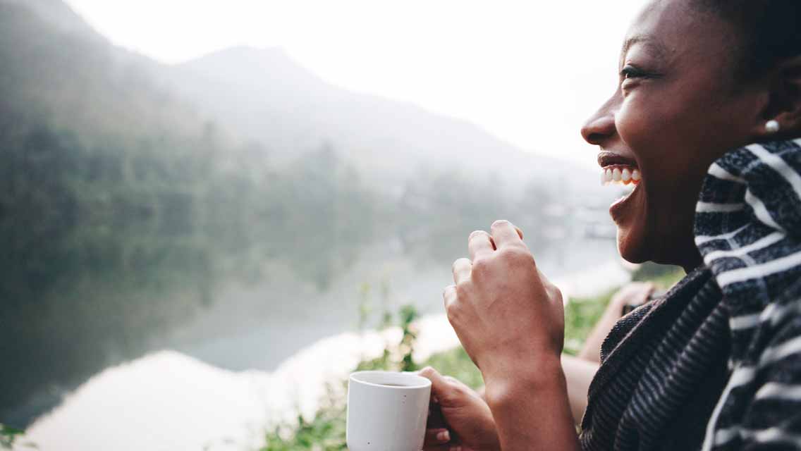 Woman drinking coffee in nature