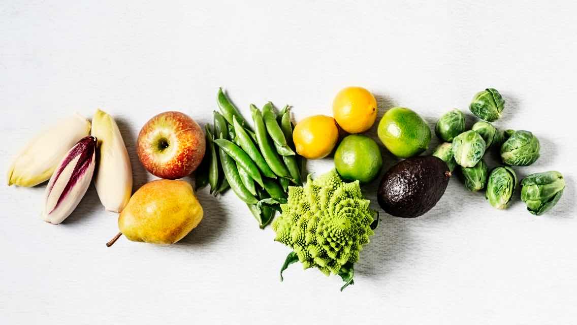 An assemblage of a variety of fresh fruits and vegetables.