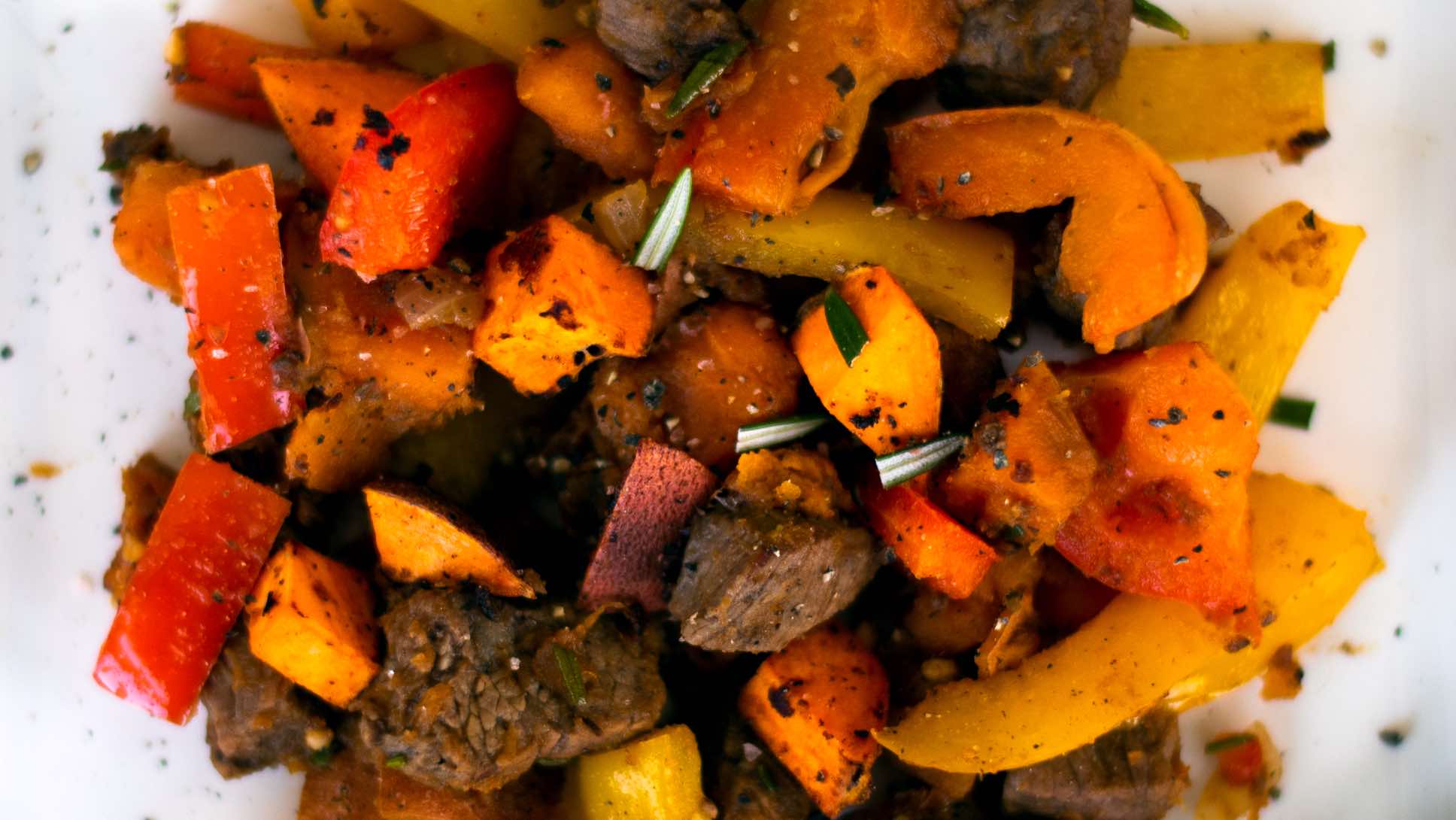 Steak bites with sweet potatoes and peppers.