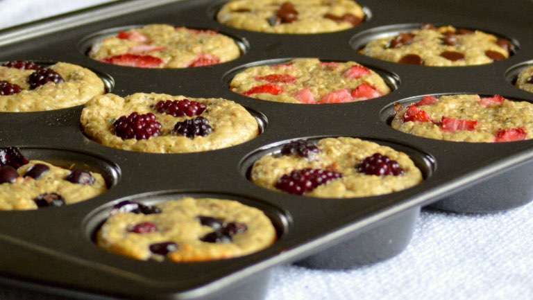 A muffin tin filled with banana oatmeal muffins.