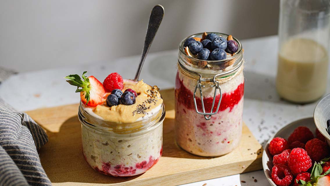 overnight-oats-2261975341 Healthy Overnight Oats With Fresh Berries And Nuts In Glass Jars