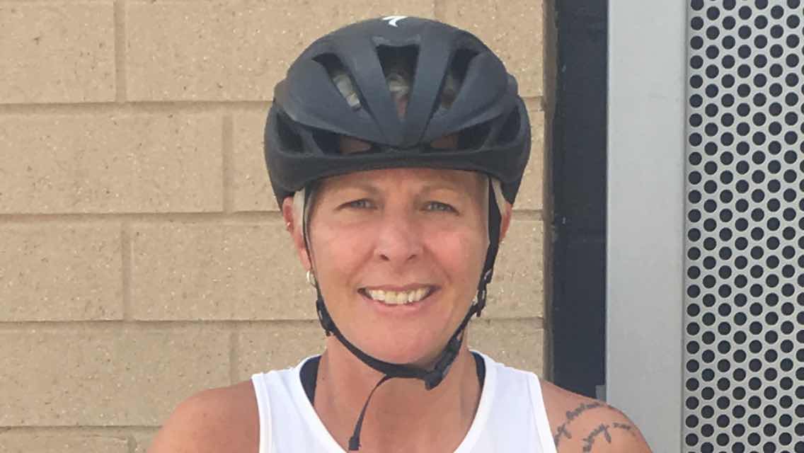 Kelly Richards wearing a bike helmet.