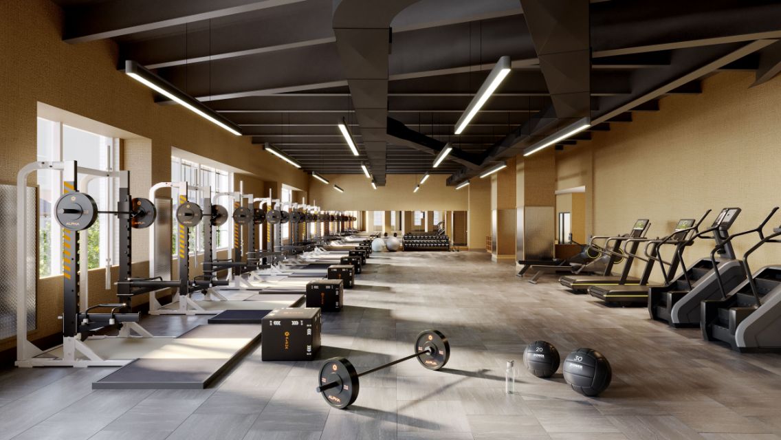 Workout floor with row of squat racks and cardio equipment at Life Time