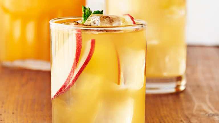 A cup of an apple-ginger kombucha mocktail.