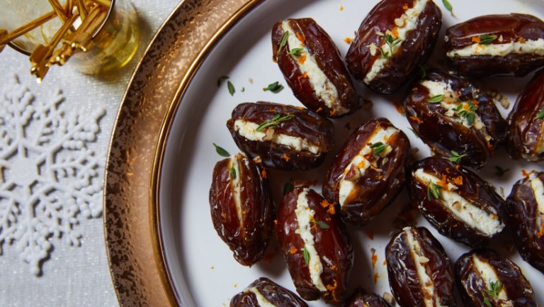 A plate of pecan and goat cheese stuffed dates.
