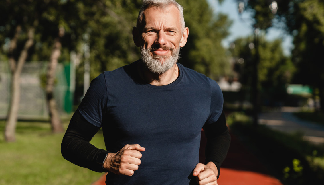 senior aged man jogging