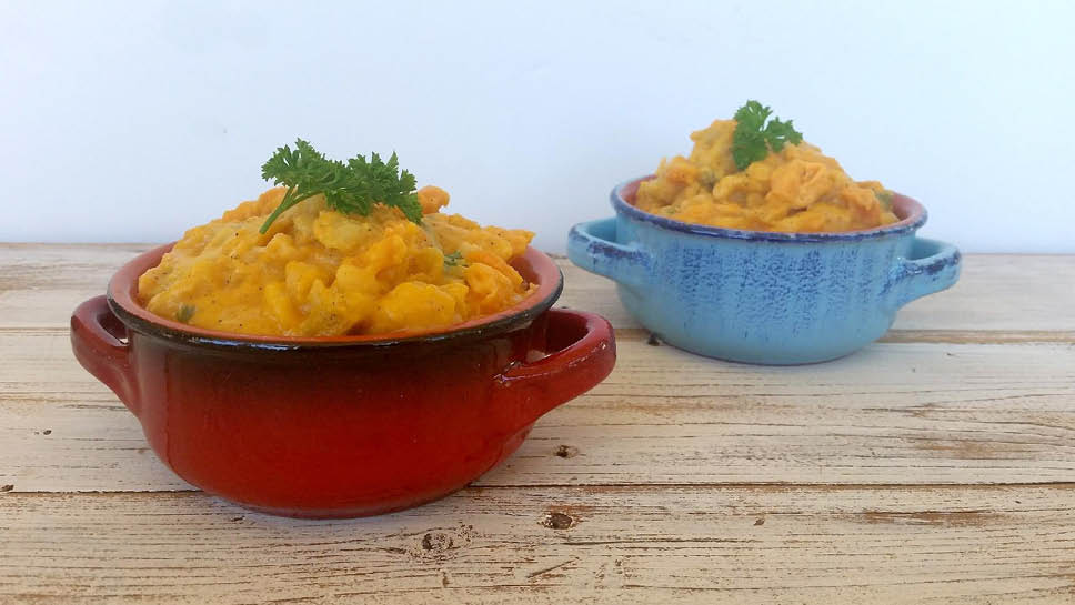 two small crocs filled with butternut squash mac n' cheese