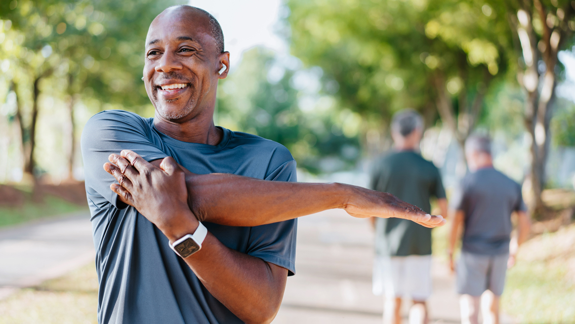 a man stretches as he prepares to work out