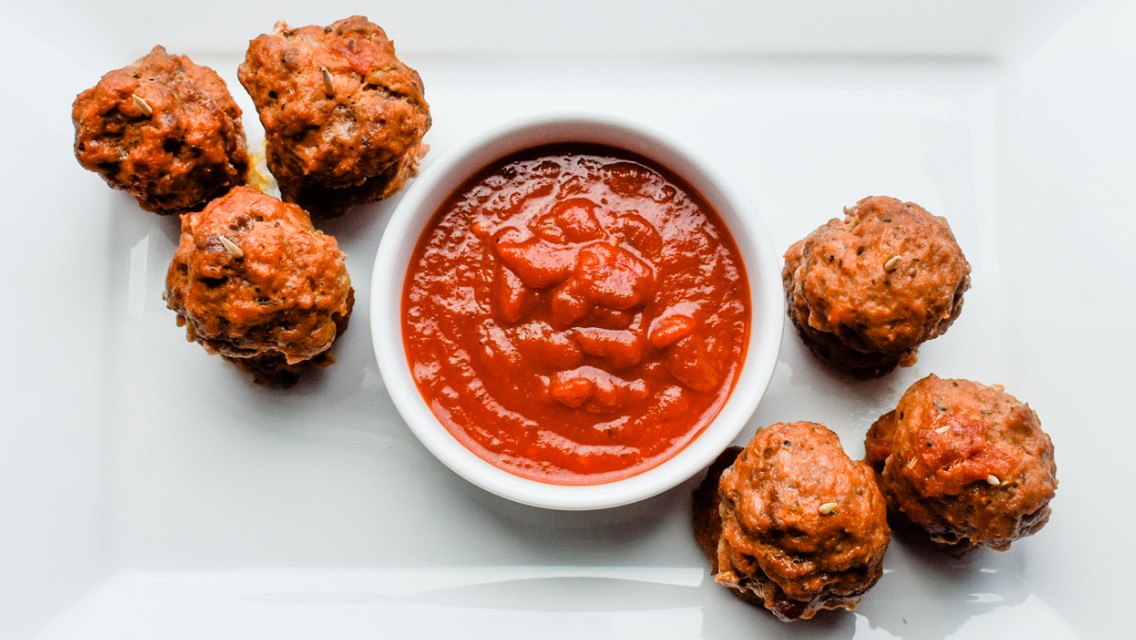 Pizza Meatballs with dipping sauce.