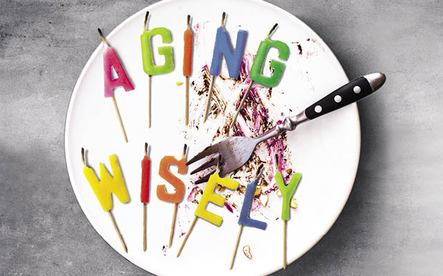 Candles on an empty plate that say "aging wisely"