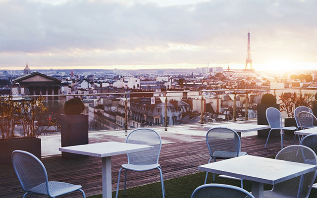 Table and chairs on a terrace in Paris