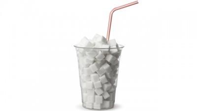 cup full of sugar cubes with straw