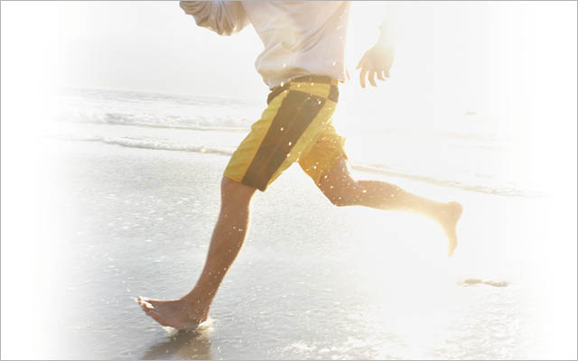 Running barefoot on beach