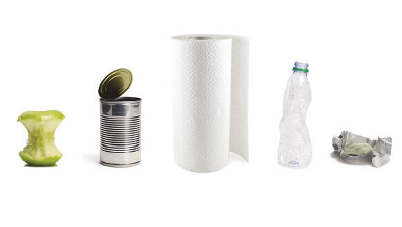 A selection of items, including an aluminum can, paper towels, and a plastic bottle