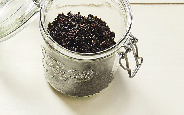 Cooked black rice in a glass jar