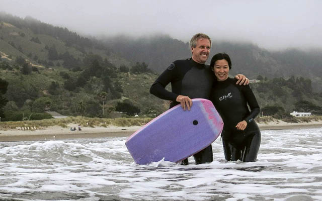 Cynthia Li in ocean with her husband